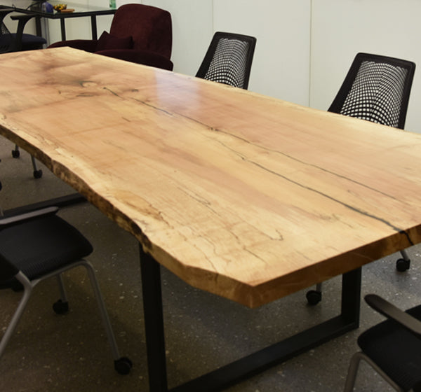 This striking single slab live edge conference table will sure to be the first thing on the agenda. It will give any boardroom or meeting room a stunning breathtaking aura. Our conference tables are made from reclaimed premium wood and handcrafted according to your specifications and design.