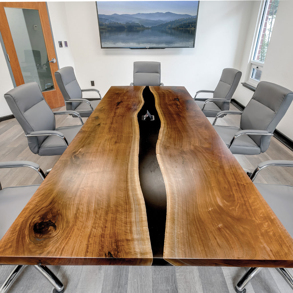 This striking single slab live edge conference table will sure to be the first thing on the agenda. It will give any boardroom or meeting room a stunning breathtaking aura. Our conference tables are made from reclaimed premium wood and handcrafted according to your specifications and design.