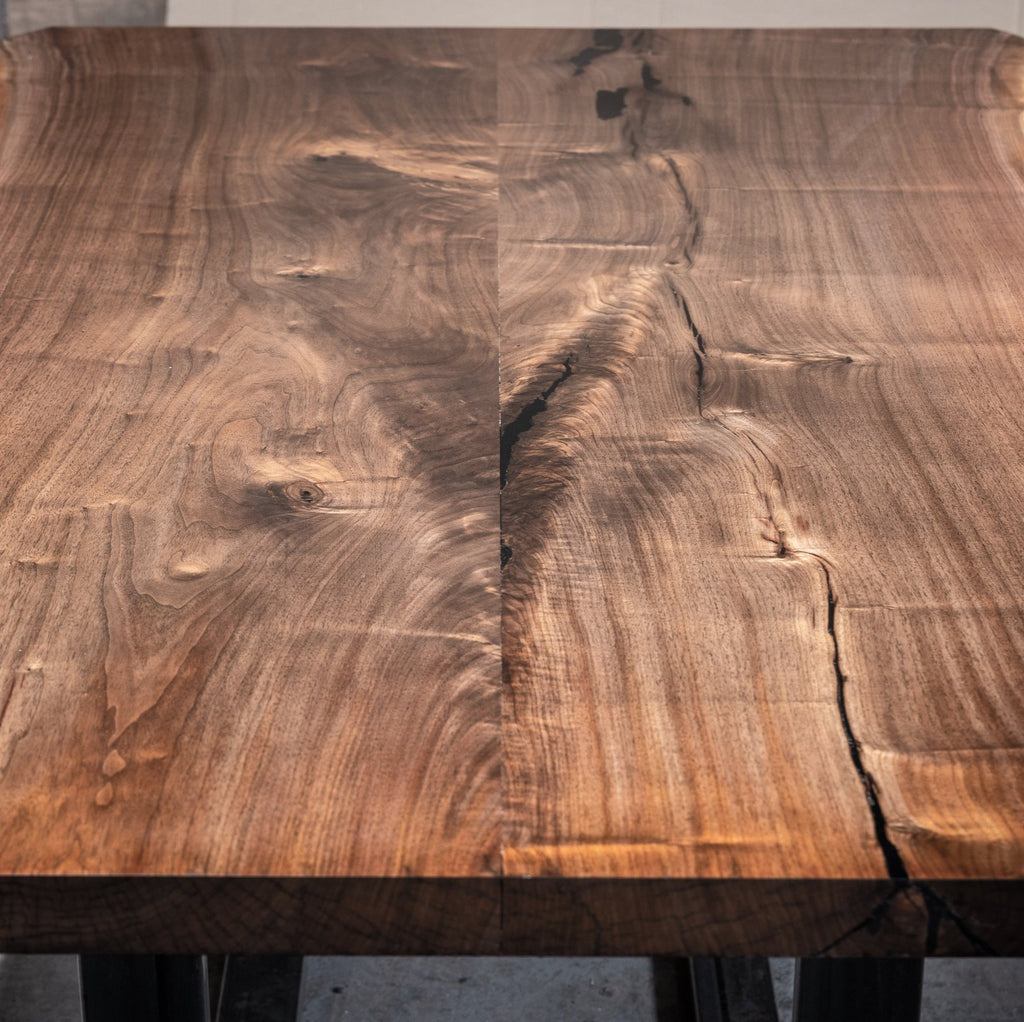 This gorgeous Live Edge Reclaimed Rosewood table will be the stand out piece in your home. Its deep reddish brown hue's provide warmth and individuality to any space in your home.